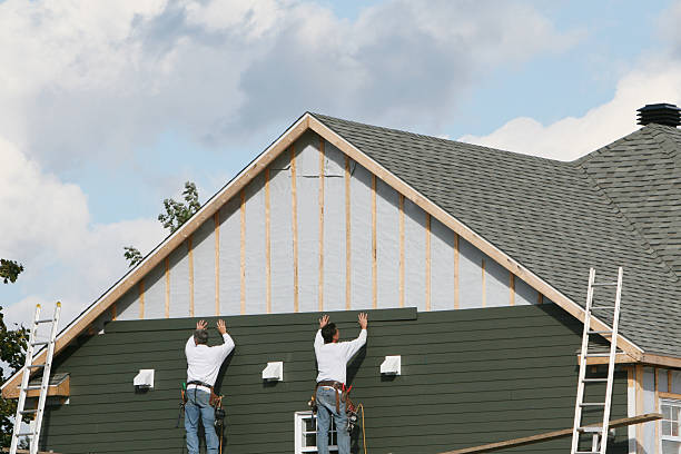 Professional Siding technician working in Vienna, GA